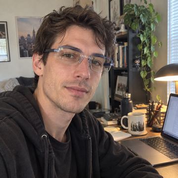 Blue clear smart zoom reading glasses at desk