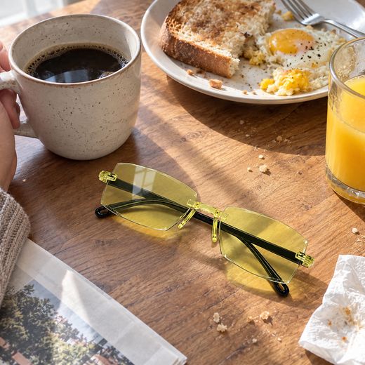 Yellow smart zoom glasses on breakfast table