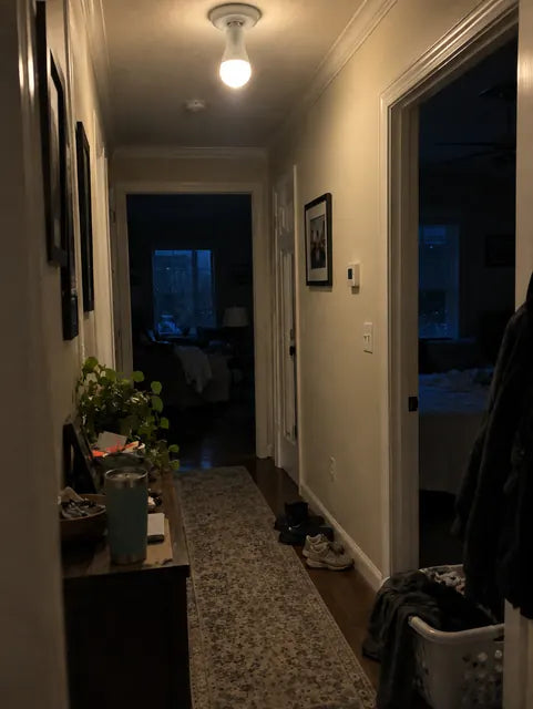Hallway lit by rechargeable emergency bulb during a power outage