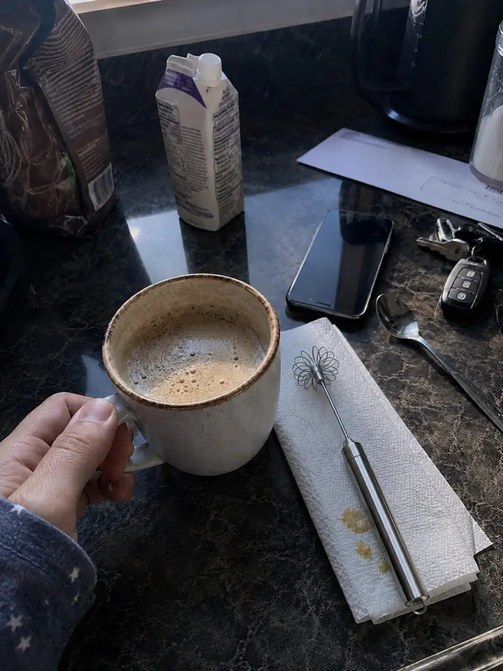 Morning coffee mixed with small whisk