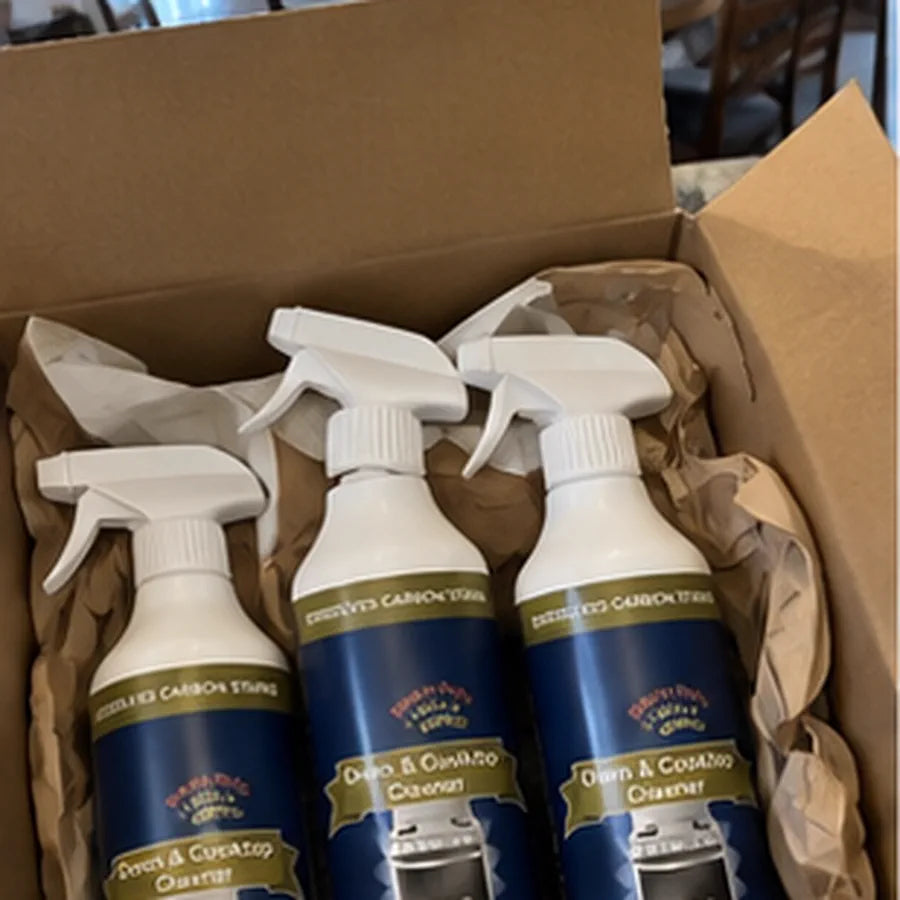 Customer photo of dirty gas cooktop beside cleaner bottle