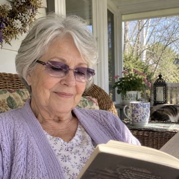 Purple tint smart zoom reading glasses while reading